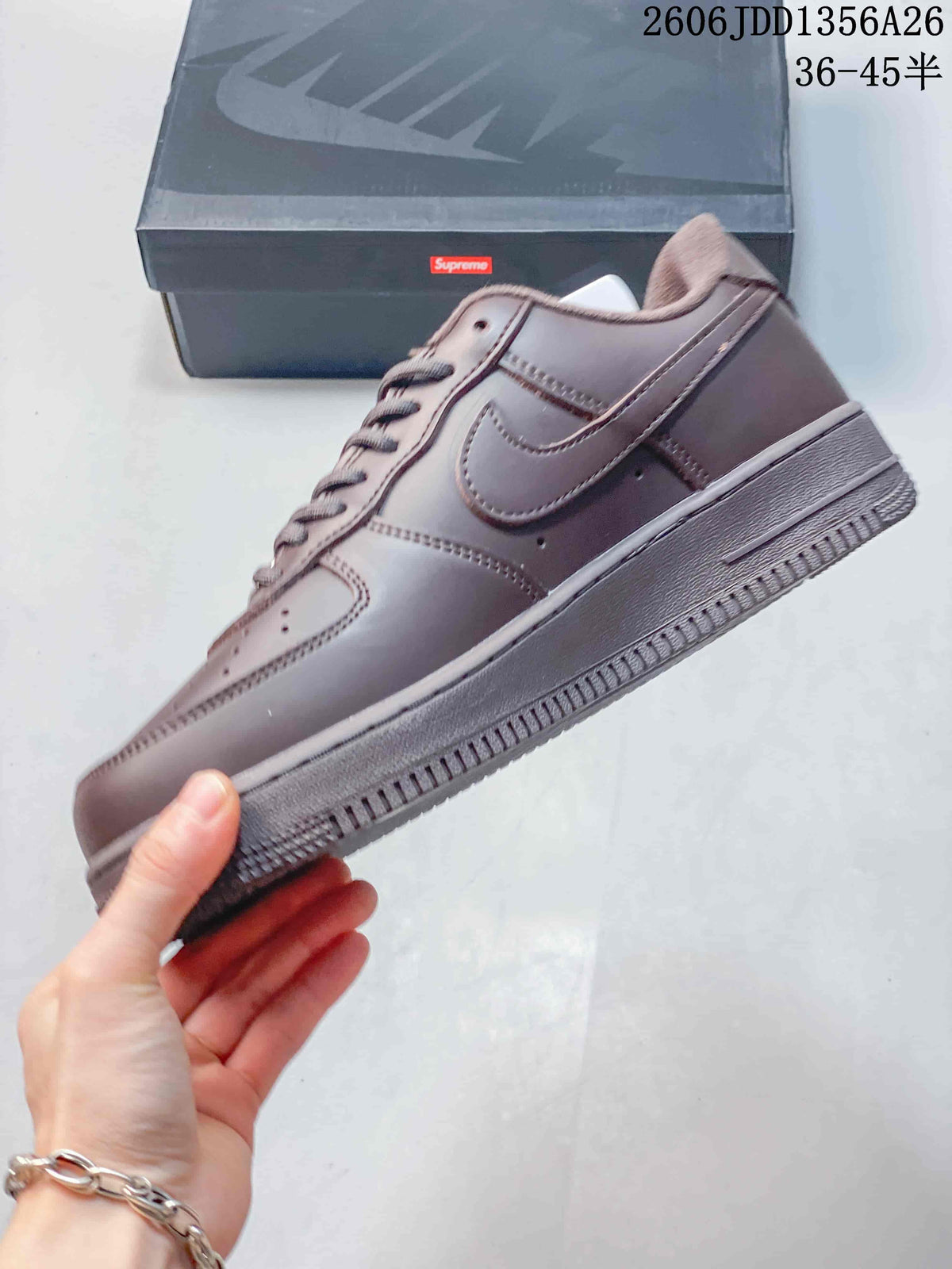 Side view of the brown low-top sneaker with a tonal Swoosh and matching sole