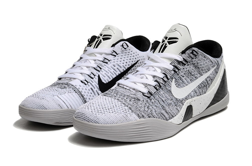 Pair of white and black Kobe 9 Low shoes shown from the front.