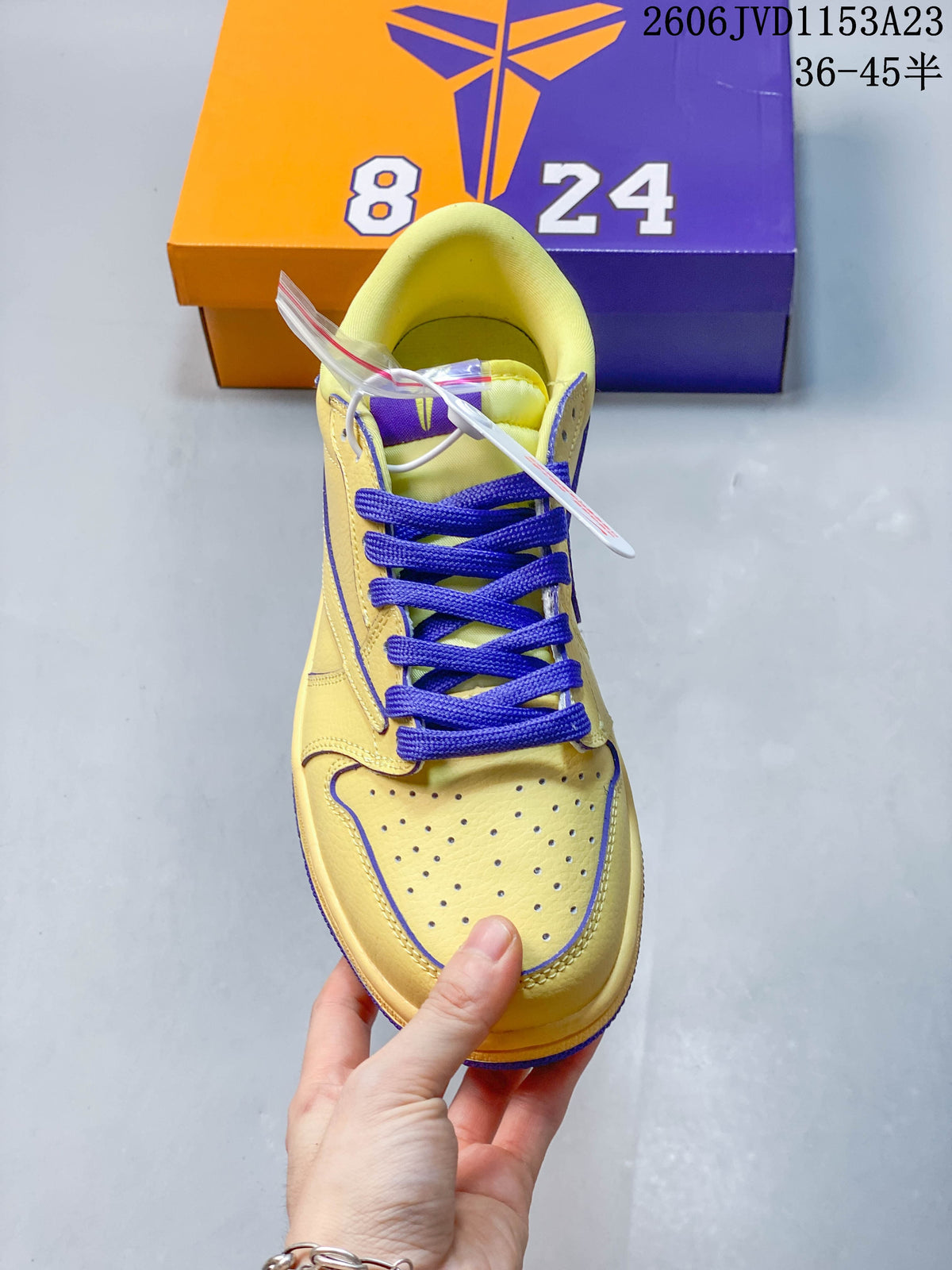 Top view of the perforated toe and purple laces