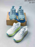 Blue and white ASICS running sneakers arranged around an ASICS shoebox.