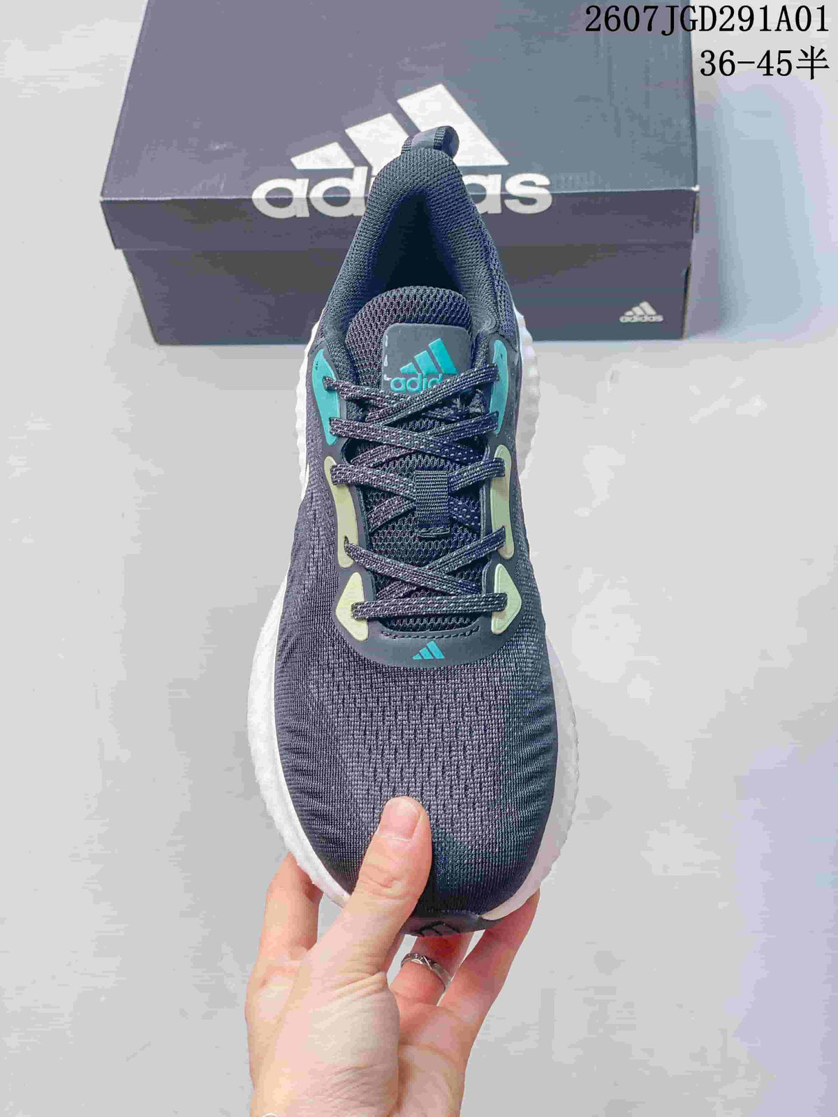 Top view of the lace-up sneaker with teal and pale green details.