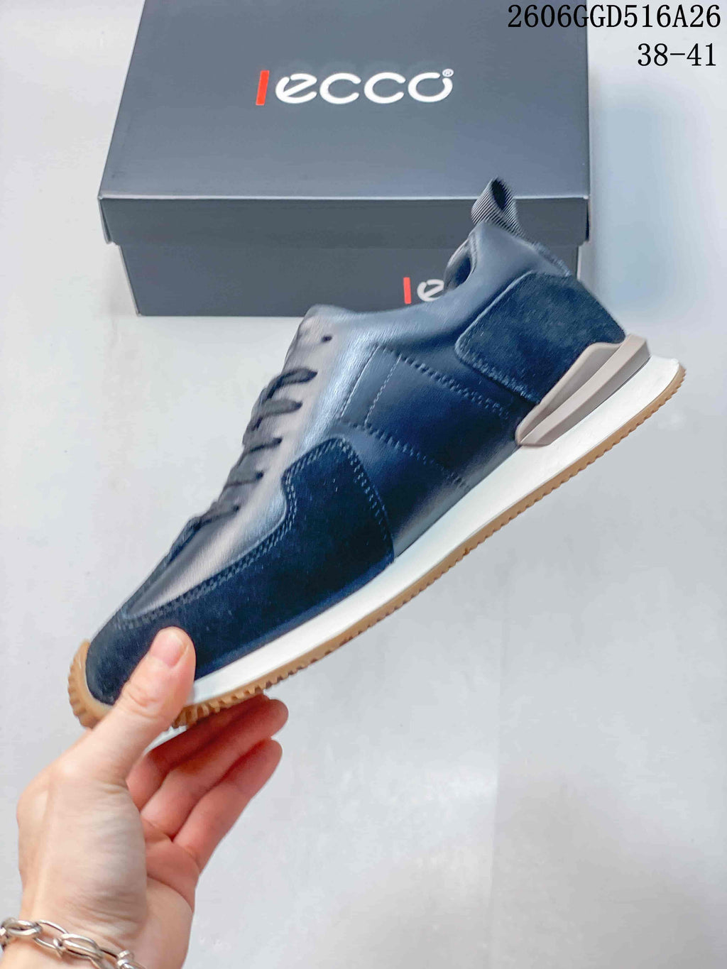 Side view of the navy sneaker with mixed-texture panels and light-colored midsole