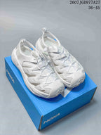 Pair of white HOKA Hopara OG outdoor sandals displayed on a blue shoe box.