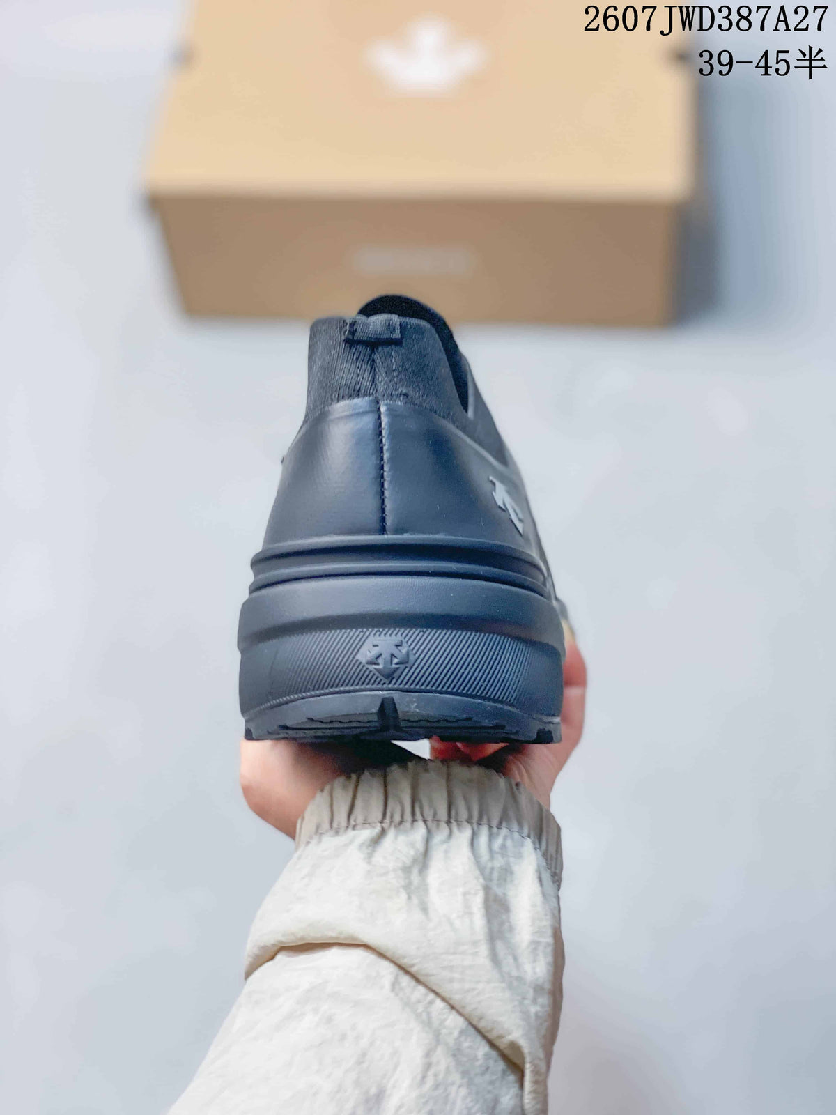 Rear view of the dark gray slip-on sneaker showing the padded heel and layered sole.