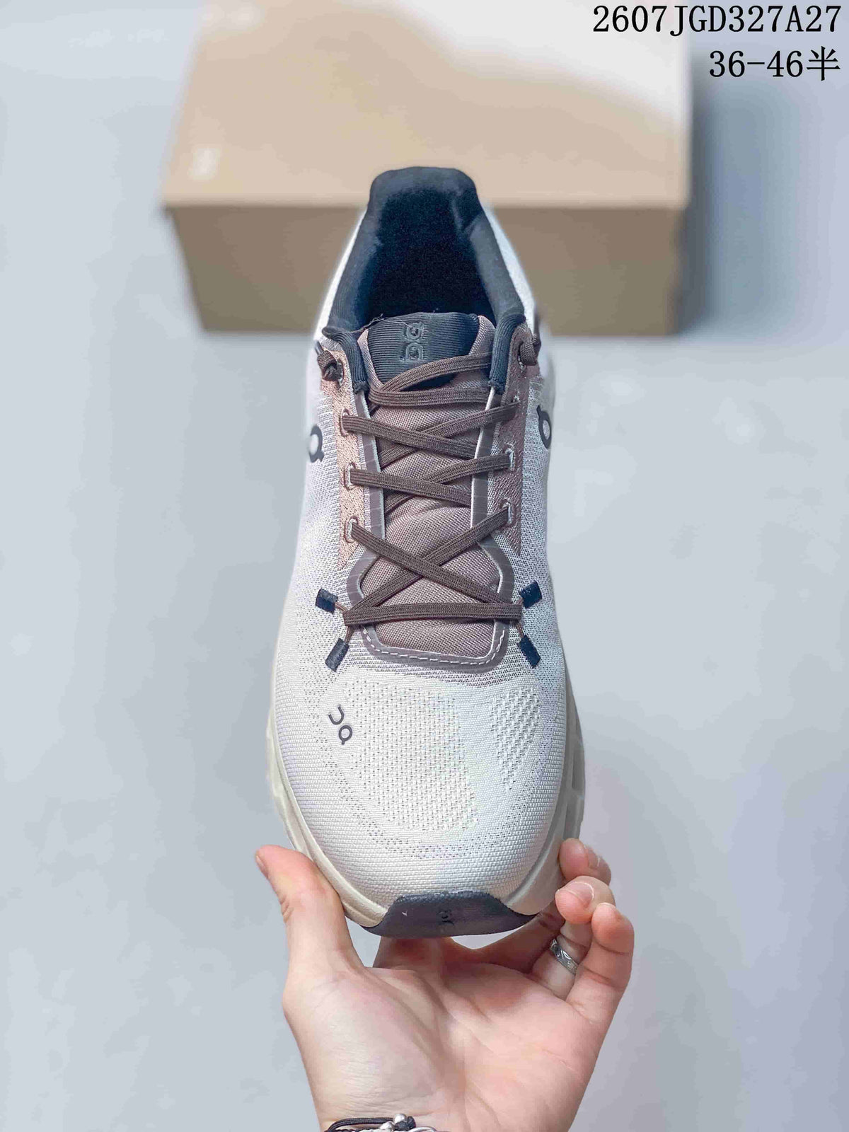 Top view of the sneaker showing the rounded toe, dark laces, padded tongue, and contrast details.