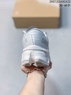 Rear view of the shoe showing the padded heel collar, On branding and segmented outsole.