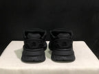 Rear view showing AMIRI branding on the heel counters and outsole sections.