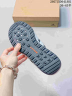 Close-up of the patterned outsole on a dark gray sneaker