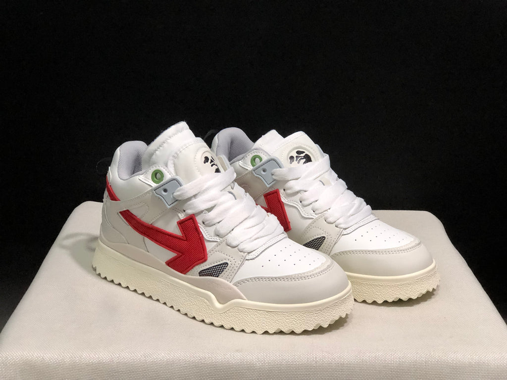 Angled front view of the white and red sneaker pair with padded collars and textured outsoles.