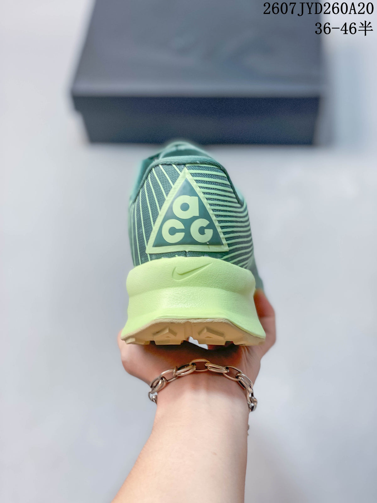 Rear view of the sneaker showing the ACG heel logo and lime midsole.