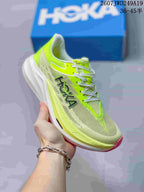 Light gray and neon green Hoka One One MAFATE X shoe with pink outsole accents.
