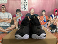 Front view of black Mizuno Wave Momentum 3 shoes with white outsoles.