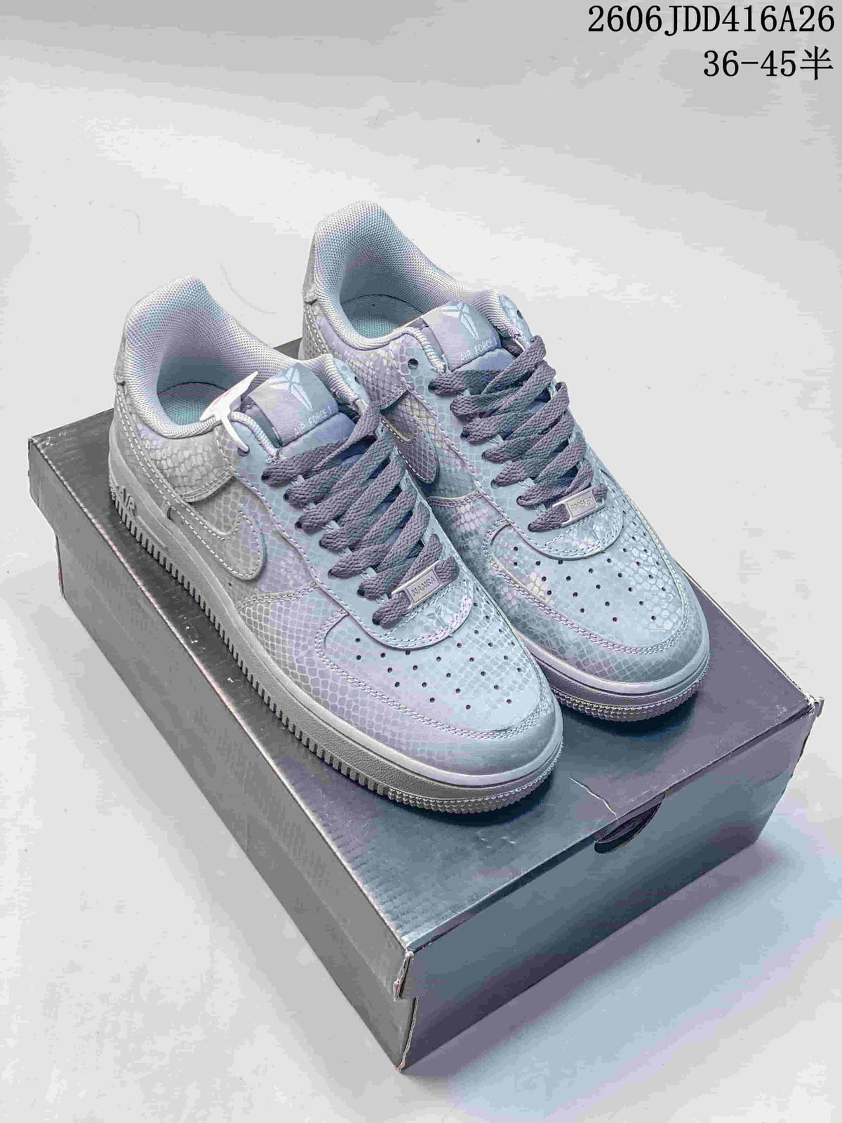 Gray patterned low-top sneakers with dark laces