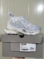 White Runner sneaker displayed on its product box; the box label shows RUNNER, W3RB 0102, White, and a photographed size C 37.