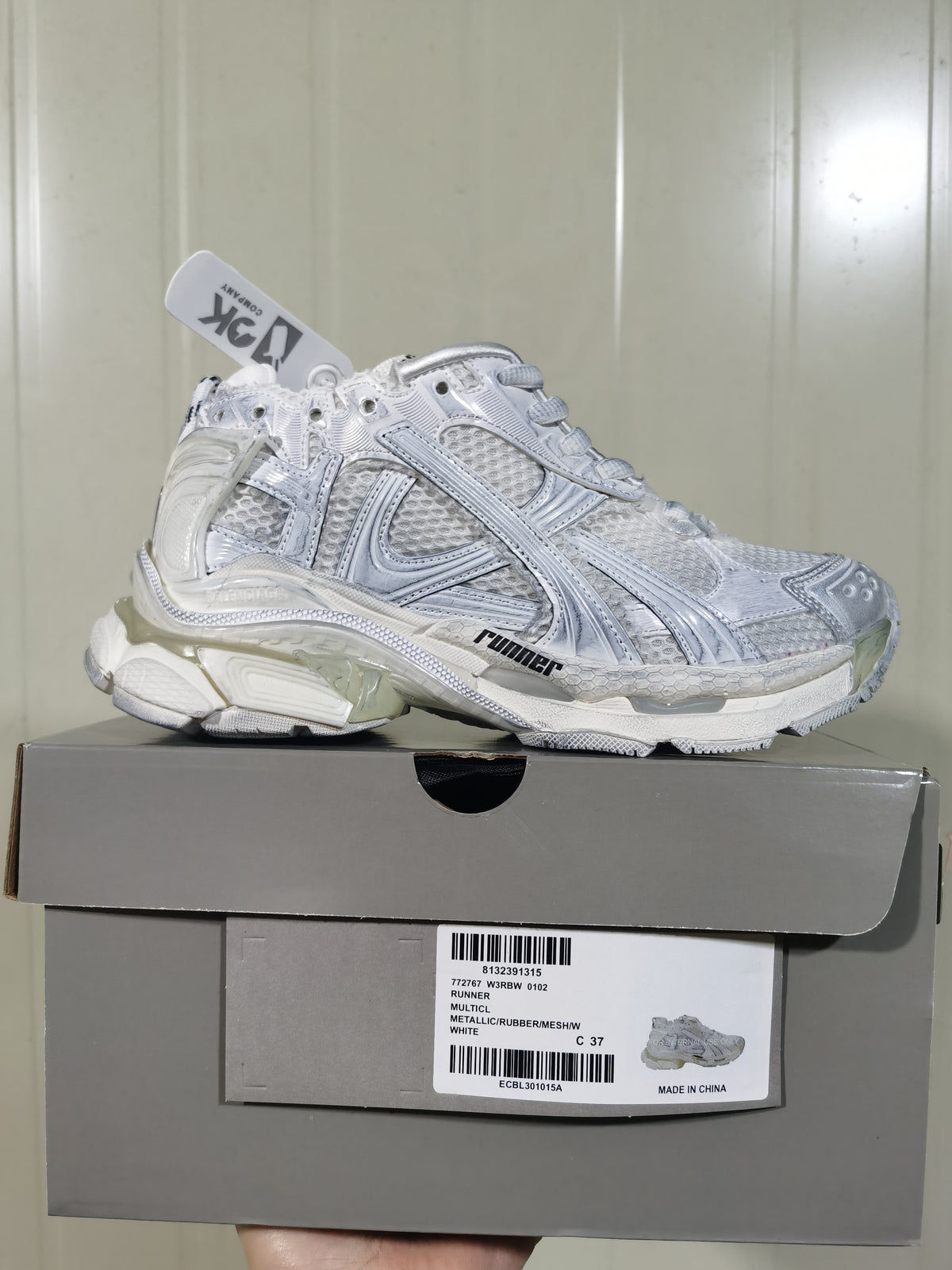 White Runner sneaker displayed on its product box; the box label shows RUNNER, W3RB 0102, White, and a photographed size C 37.