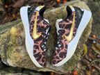 Overhead view of a pair of Nike Kobe 8 shoes with leopard print and gold accents