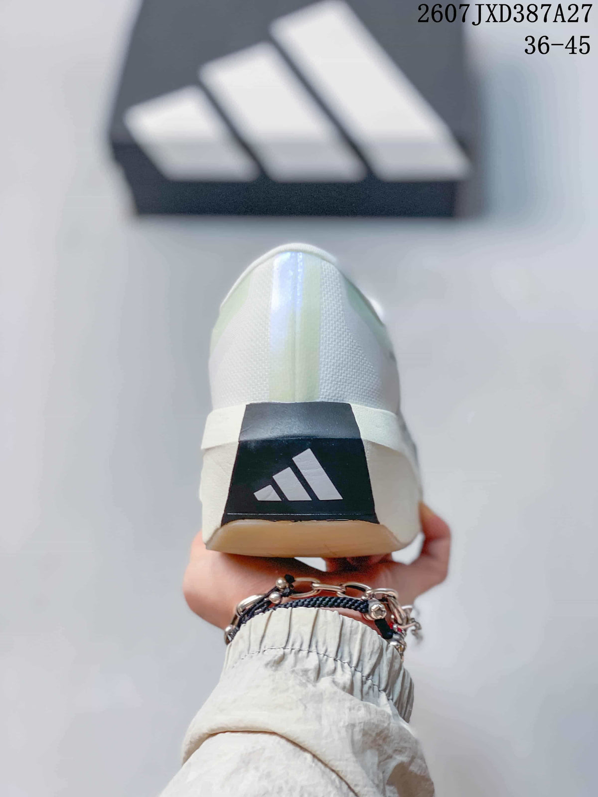 Rear view of the white sneaker showing the adidas logo on a dark heel panel.