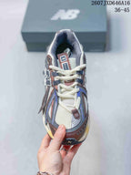 Top view of the New Balance sneaker showing the mesh-like tongue area, laces and layered toe panels.