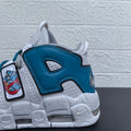 Close-up of the blue heel panel, cartoon bear graphic and speckled white sole