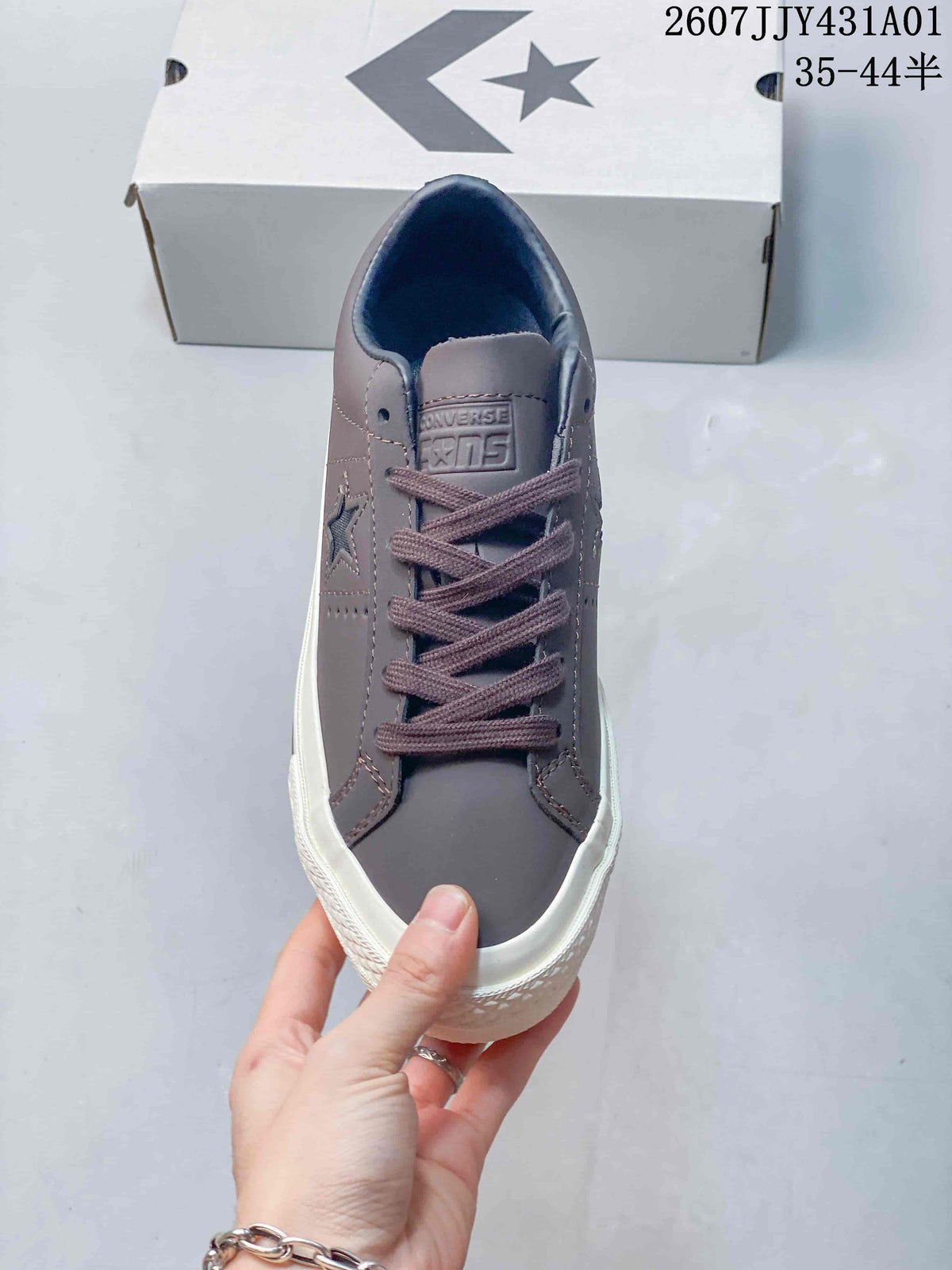 Front view of the gray lace-up sneaker with blue lining