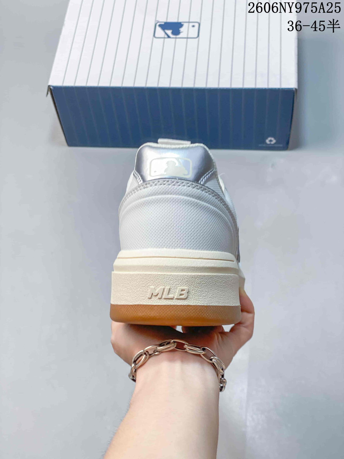 Rear view of the sneaker showing the padded heel, MLB heel lettering, layered platform sole, and gum outsole edge.