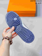 Close-up of the blue rubber outsole showing circular and segmented traction grooves.