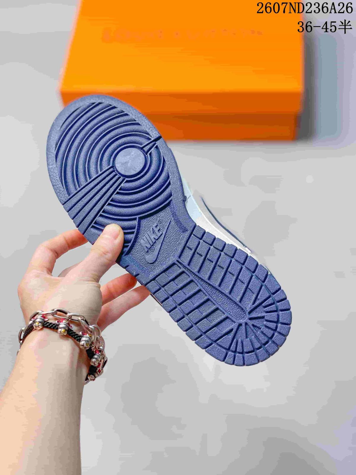 Close-up of the blue rubber outsole showing circular and segmented traction grooves.