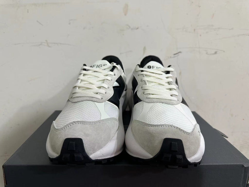 Front view showing white laces, light gray overlays, and black accents