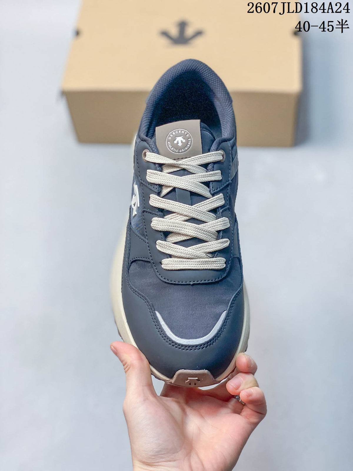 Top view of a navy lace-up sneaker with cream laces, padded collar and contrasting toe trim.