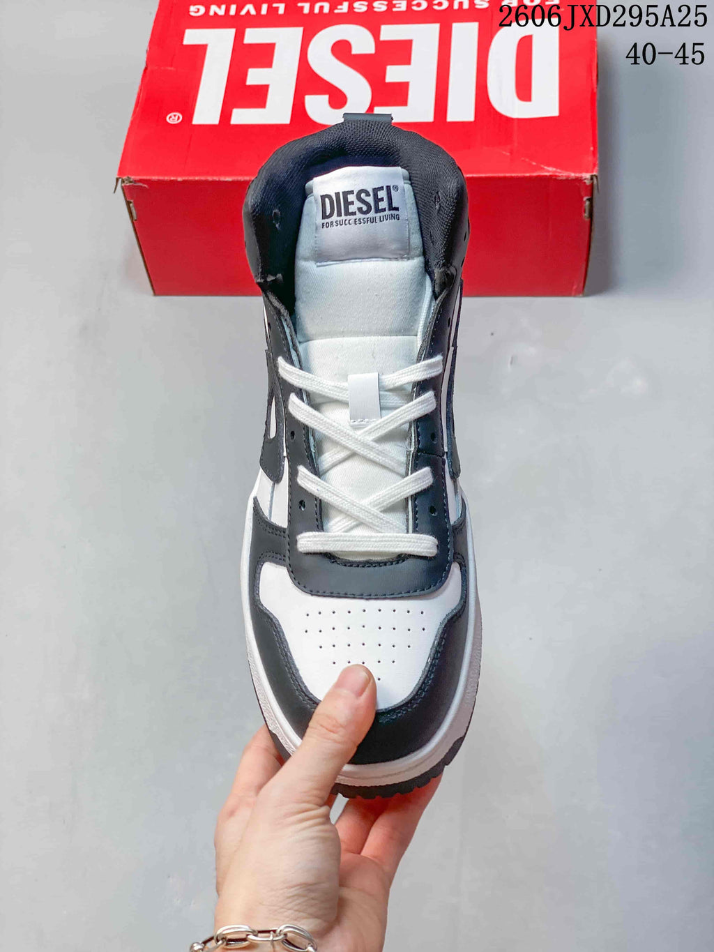 Front view of a Diesel sneaker with a perforated toe and lace-up front