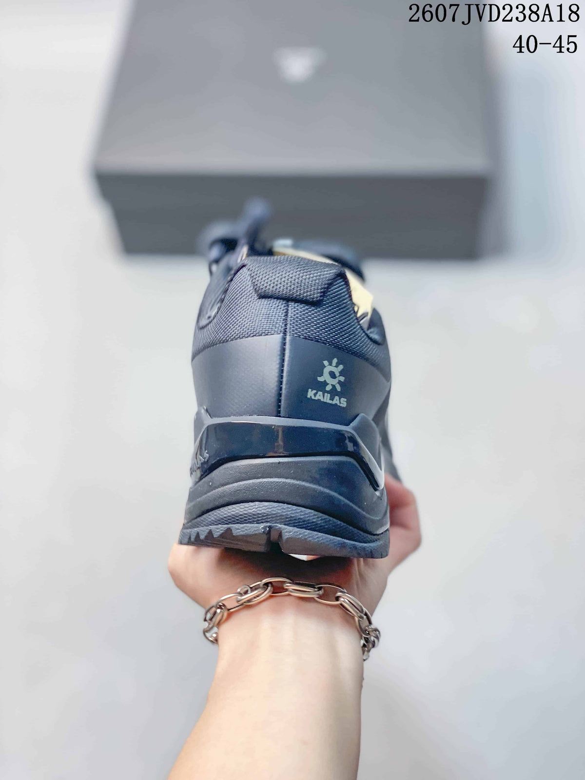 Rear view of the dark gray hiking shoe showing the KAILAS heel logo, padded collar, and layered heel structure.