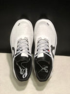 Top-down view showing the white textured uppers, black padded collars, and patterned laces.