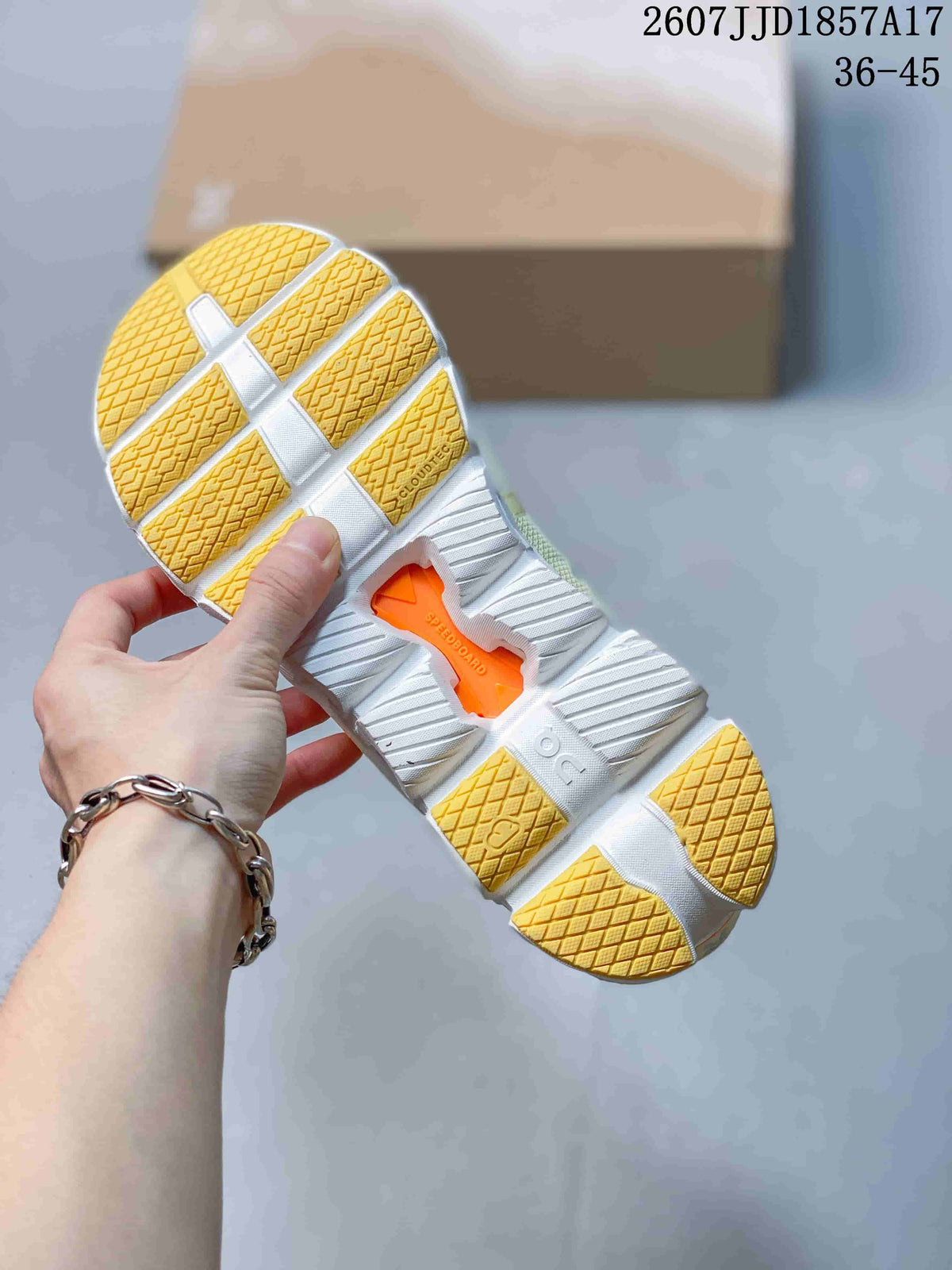 Close-up of the white and yellow segmented outsole showing CloudTec and Speedboard markings.