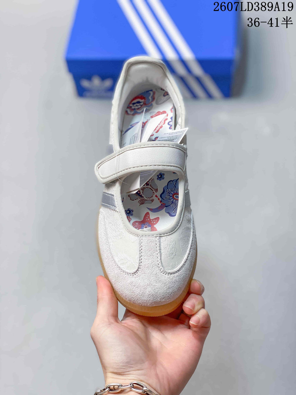 Top view showing the rounded toe, hook-and-loop strap, and floral printed insole.