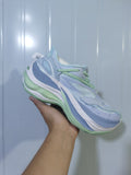Side view of pale blue and green Balenciaga 9191 sneakers showing layered panels, mesh sections, and a sculpted sole.
