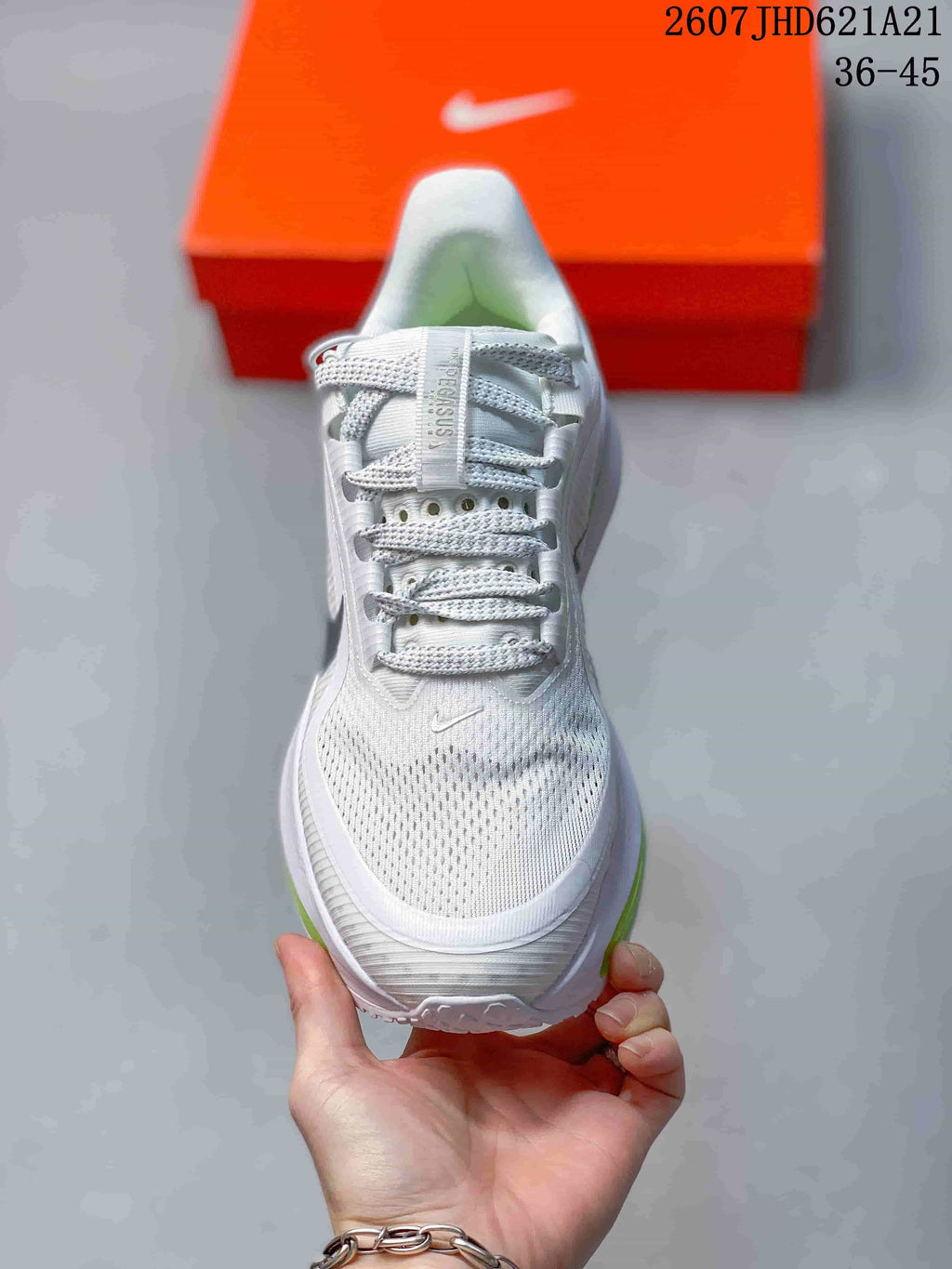 Front view showing the white mesh toe box, gray laces, and padded tongue.