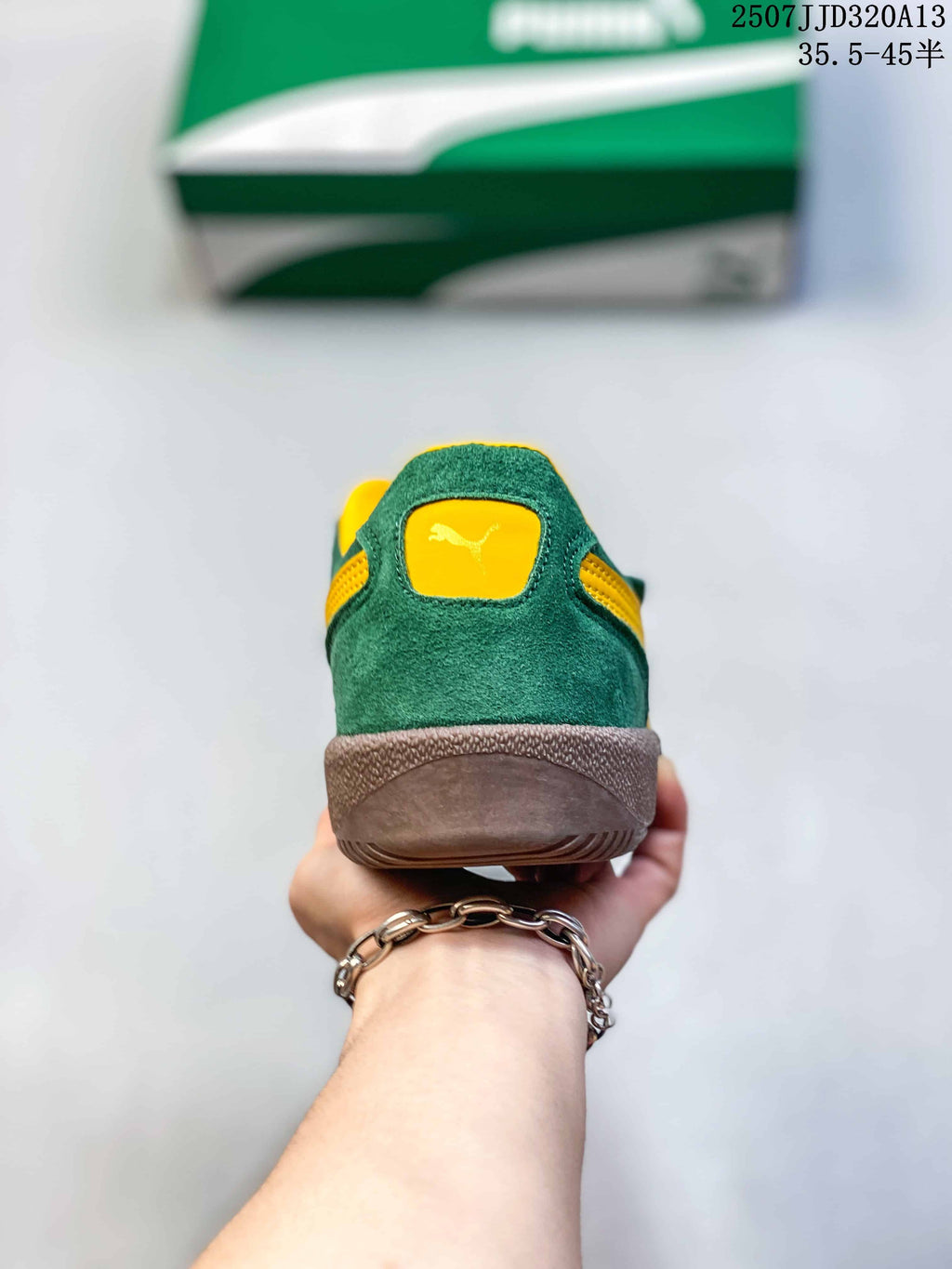 Rear view showing the green heel, yellow collar lining, and PUMA heel logo.