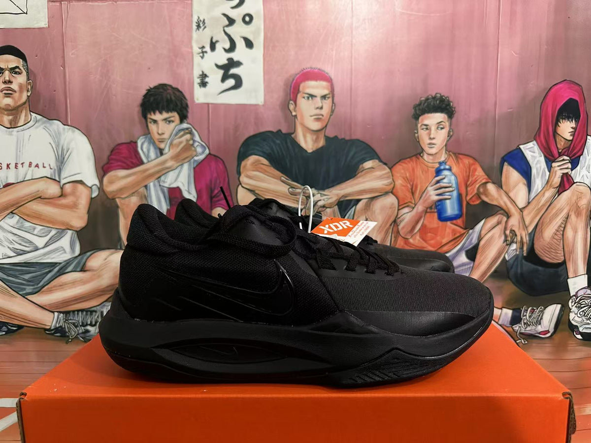 Side view showing the Swoosh and layered black upper