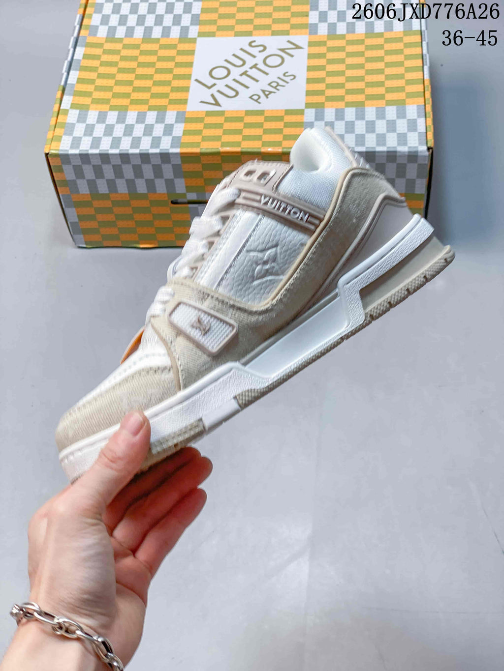 Side view showing the layered panels of a Louis Vuitton Trainer sneaker
