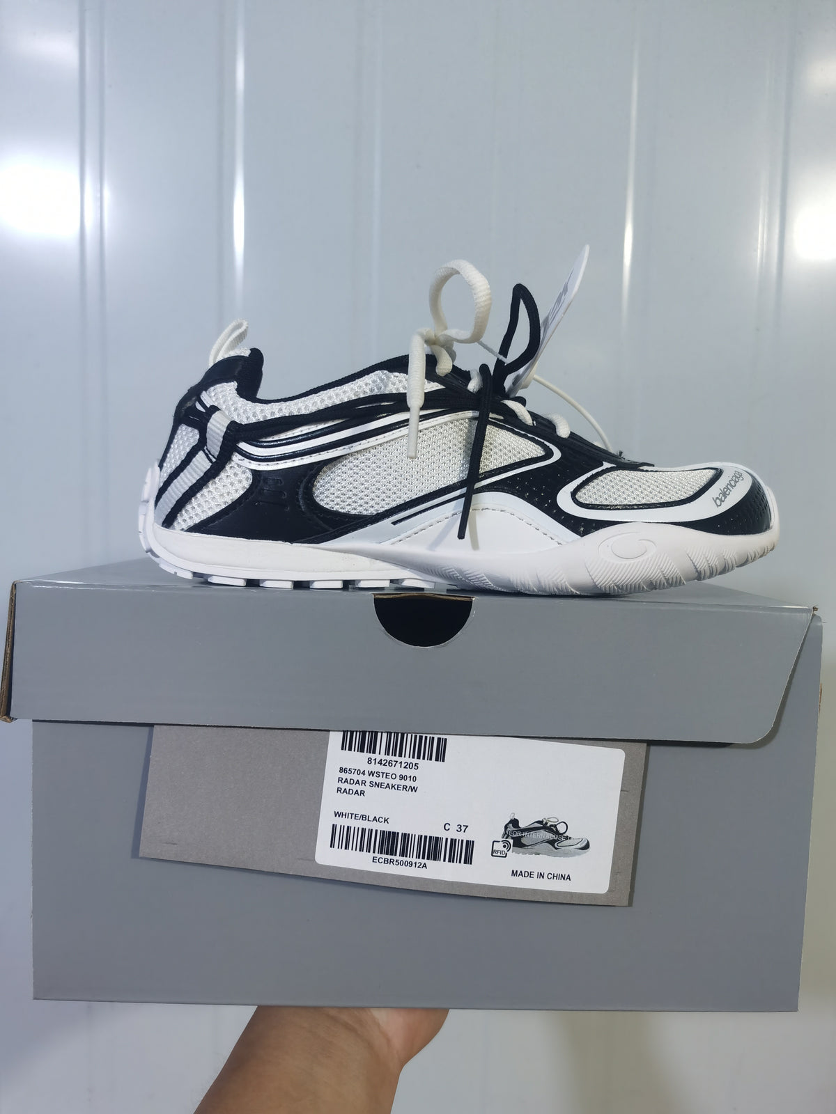 Balenciaga Radar sneaker displayed on its box; the label shows Radar Sneaker 9010, White/Black and photographed size C 37.