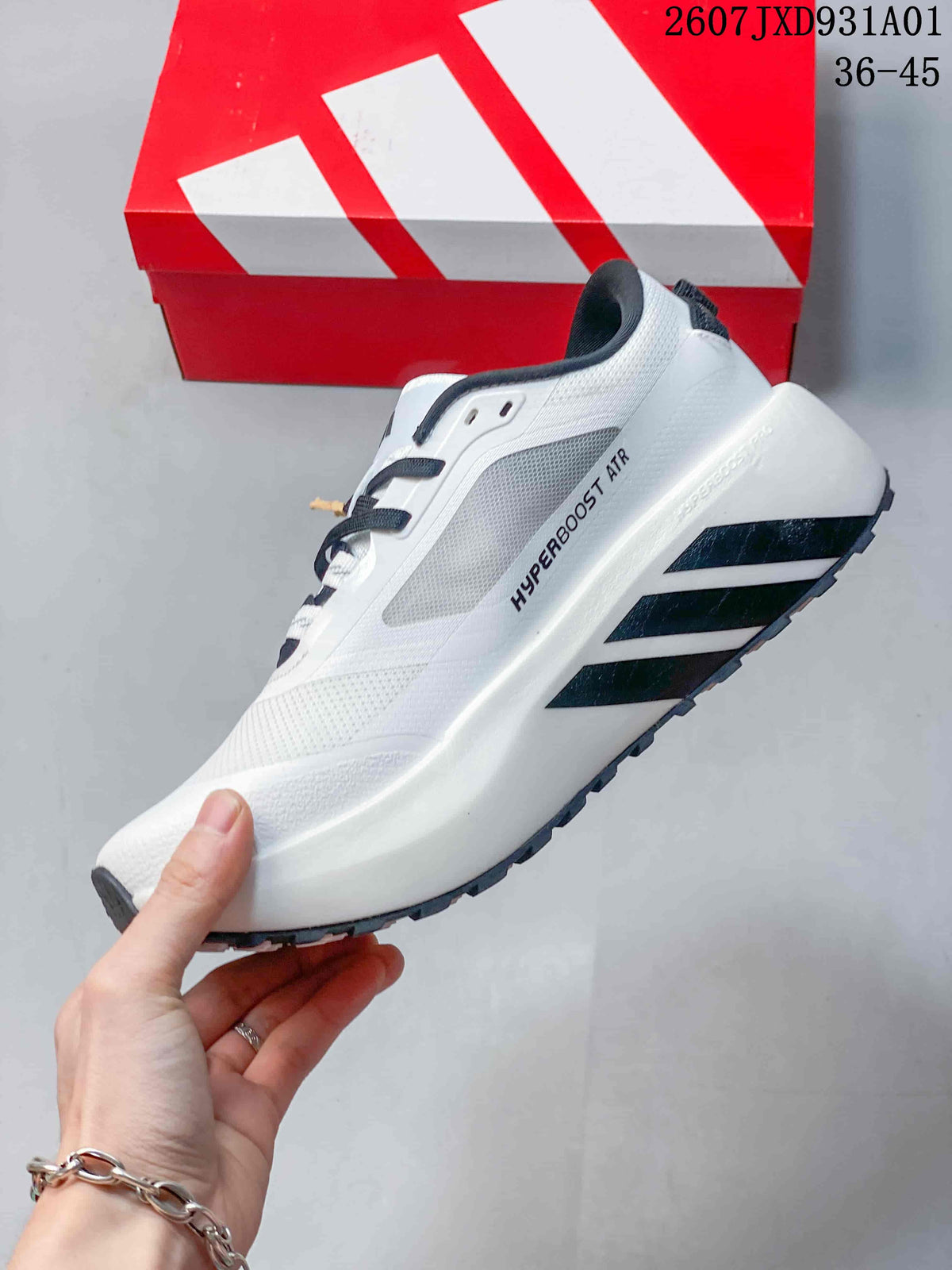 Side view of the white sneaker with black stripes and Hyperboost ATR marking.