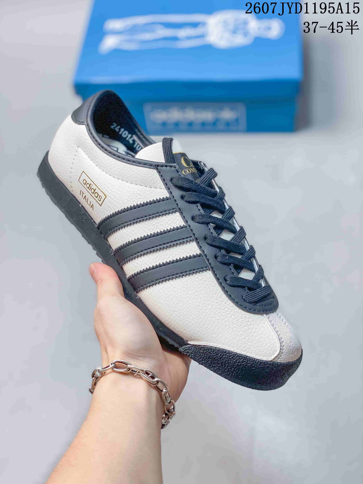 Angled side view showing the adidas Italia heel branding, three stripes, and textured toe overlay.