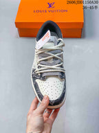 Front view highlighting the perforated toe and patterned lace panels