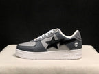 Side profile showing the black star side detail, dark gray panels, and white textured sole.