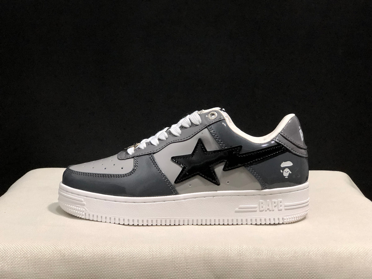 Side profile showing the black star side detail, dark gray panels, and white textured sole.