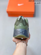 Rear view of the Nike training shoe showing the padded heel, heel pull tabs, Swoosh detail and navy outsole section.