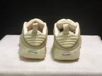 Rear view of the pair showing heel pull tabs, layered heel details, and silver heel branding.
