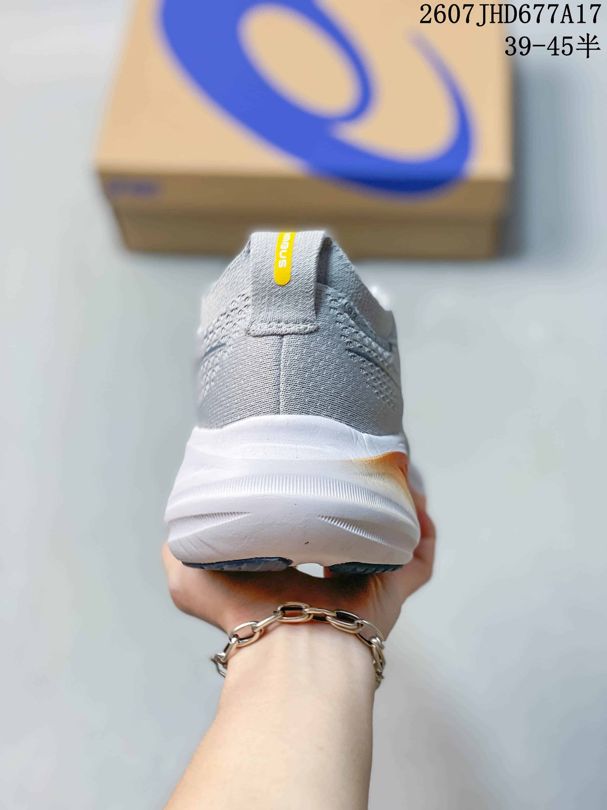 Rear view of the gray running sneaker showing the padded heel collar, heel pull tab, and thick white midsole.