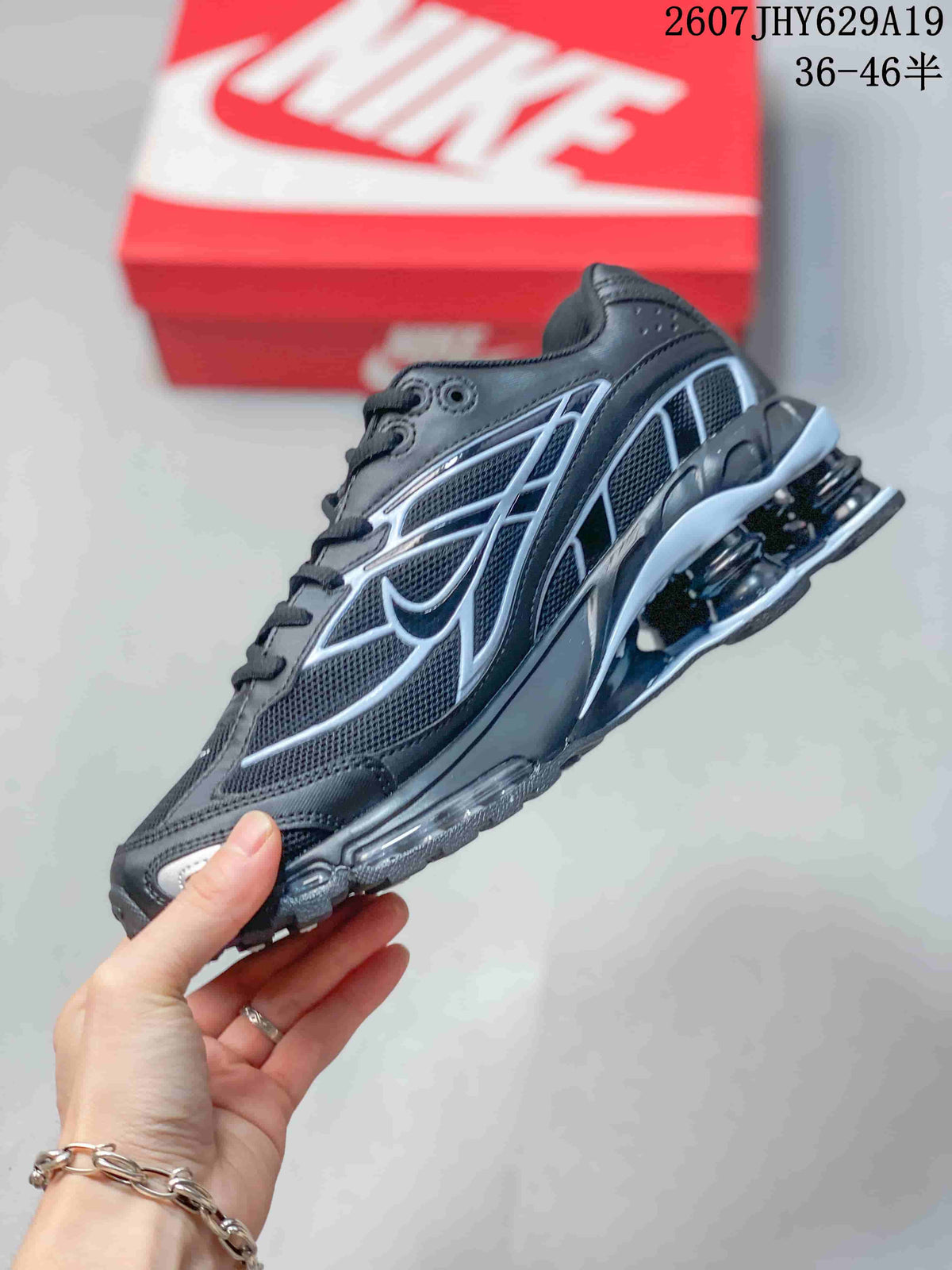 Side view highlighting the layered upper, outlined detailing, and heel columns.