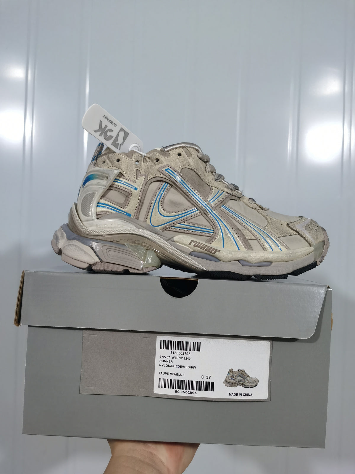 Puma 2240 Runner sneaker in taupe and blue displayed on its product box, with the label showing style 2240 Runner and sample size C 37.